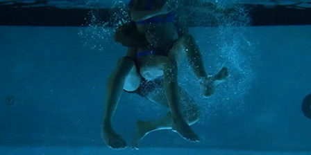 Stepdad sexually molestating young stepdaughter in a swimming pool
